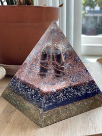 a pyramid with a pair of shoes on top of it