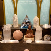 a display of crystals and buddha statues