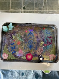 a tray with flowers and butterflies on it