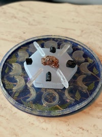a blue plate with stones on it