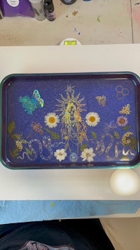 a tray with flowers and butterflies on it