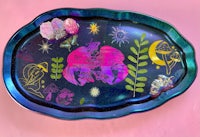 a tray with a blue and pink design on it