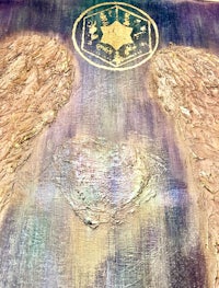 two angel wings on a piece of paper