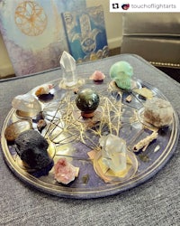 a tray of crystals and stones on a couch