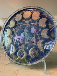 a blue plate with an image of the moon on it