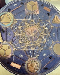 a blue plate with various geometric shapes on it