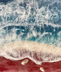 a painting of a beach with waves and shells