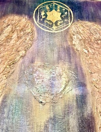 two angel wings on a piece of paper